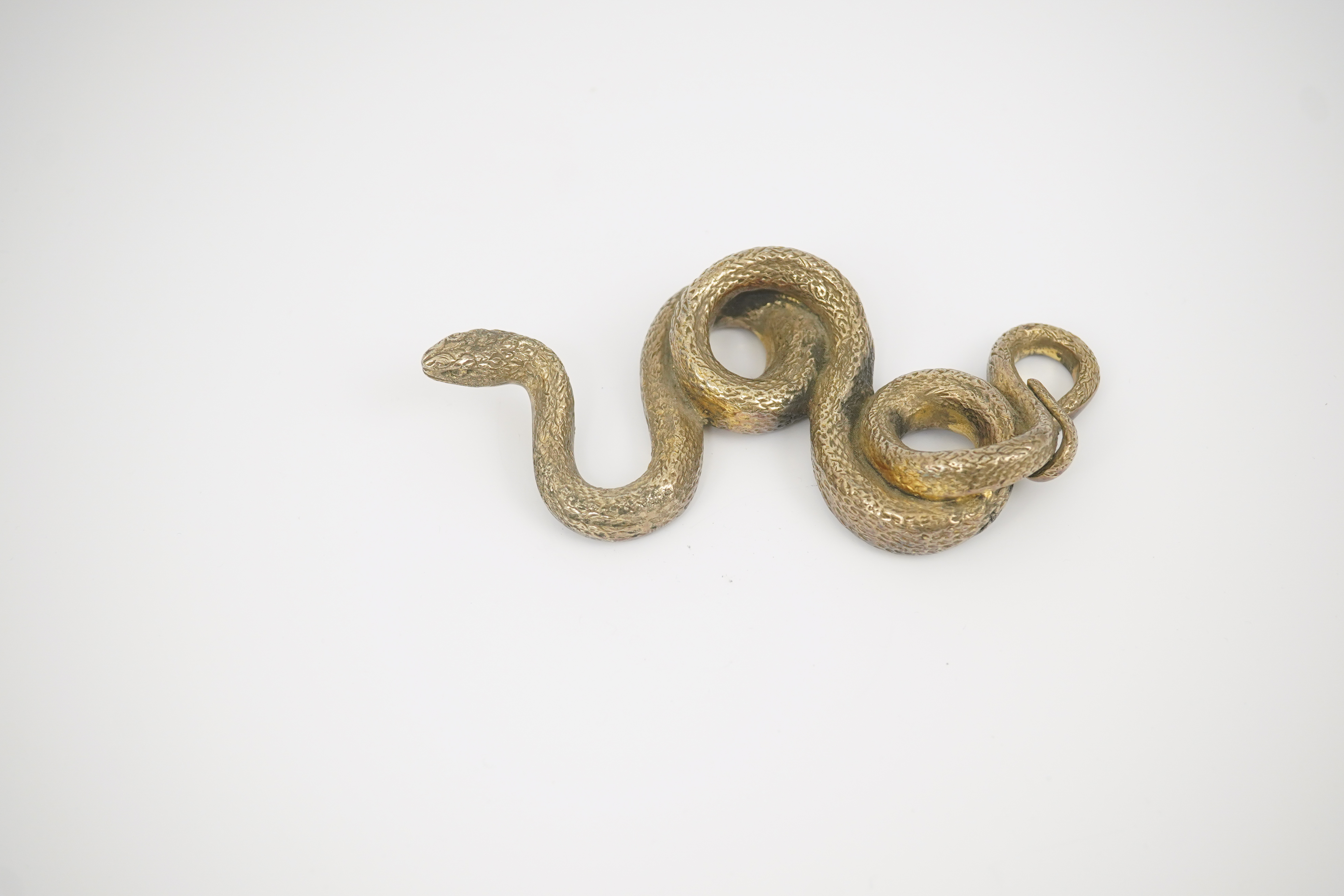 A Sterling silver gilt model of a snake, stamped PR.S